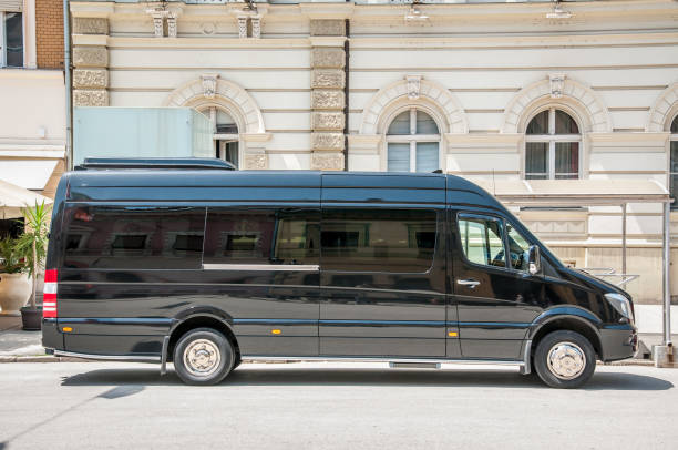Mercedes Benz sprinter black luxury shuttle bus van parked on the street. June - 12. 2018. Novi Sad, Serbia.